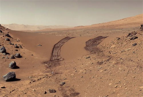 Martian landscape with rover tracks in sandy terrain, representing the alien environments that inspire Mars-like hiking trails on Earth