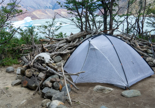 Ultralight tent set up in Patagonian wilderness, demonstrating a sub-2-pound shelter built with advanced materials like graphene and super-polymers