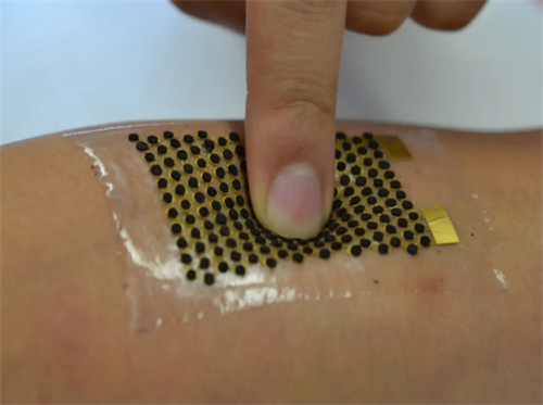 Stretchable electronic skin patch applied to the body, a prototype for sweat-powered wearable tech that harvests energy from perspiration